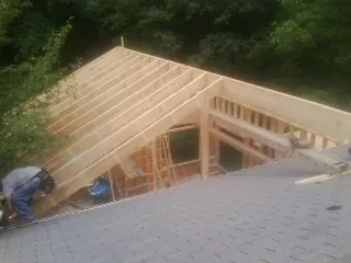 Framing a new roof addition that ties into an existing shingle roof in Smithville
